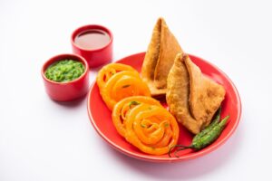 veg samosa with jalebi snack combination also called imarti and sambusa samusa free photo
